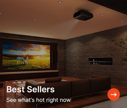 A modern home theater with a large screen showing a sunset scene with horses. Cosy brown seating, stone walls, and soft lighting create a warm ambiance.