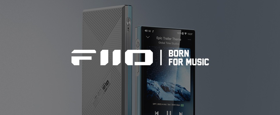 Close-up of a portable audio player with a textured grey back and a screen displaying "Epic Trailer Theme." The words "FiiO | Born for Music" are visible.