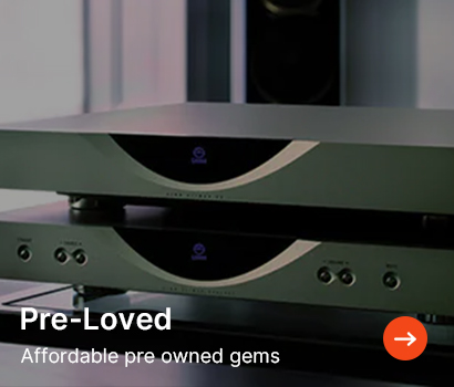 Stacked audio amplifiers in a dimly lit setting. Text reads "Pre-Loved: Affordable pre-owned gems" with an arrow icon, conveying value and elegance.