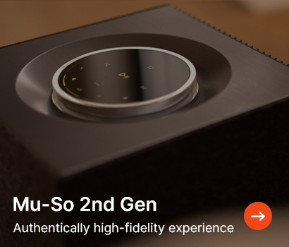 A sleek, dark audio system with a circular dial on top labelled "Mu-So 2nd Gen." Text below reads "Authentically high-fidelity experience" with an orange arrow.