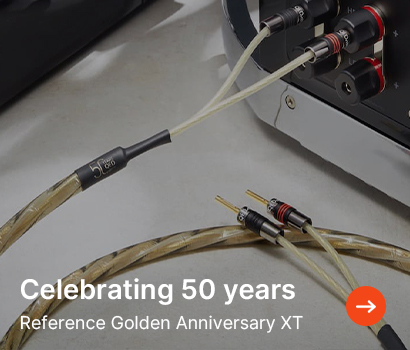Cable connectors plugged into audio equipment, highlighted with "Celebrating 50 years" text, featuring Reference Golden Anniversary XT. 