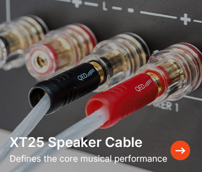 Close-up of XT25 speaker cables connected to a receiver with black and red plugs. Text reads “Defines the core musical performance.”