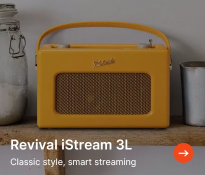 Vintage-style yellow radio with a handle and mesh speaker, placed on a rustic wooden shelf. Text reads "Revival iStream 3L. Classic style, smart streaming."