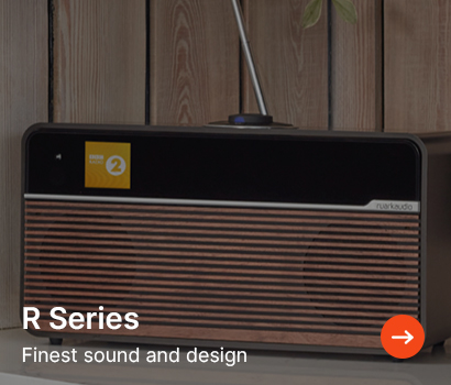 A retro-style radio with wood panelling against a wood backdrop. Text reads "R Series: Finest sound and design" with an orange arrow icon.