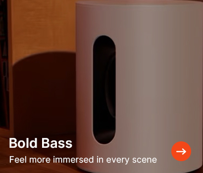 White cylindrical speaker with an oval cut-out against a brown background. Text overlay reads "Bold Bass" and "Feel more immersed in every scene." Arrow icon.