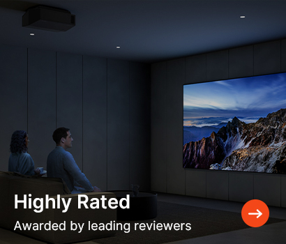 Two people sit in a dimly lit room watching a large TV displaying a mountain landscape. Caption reads: "Highly Rated, Awarded by leading reviewers."