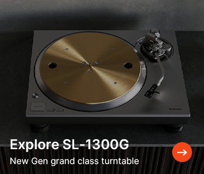 A sleek SL-1300G turntable with a metallic gold platter on a dark surface. Text reads 'Explore SL-1300G: New Gen grand class turntable' with an arrow.