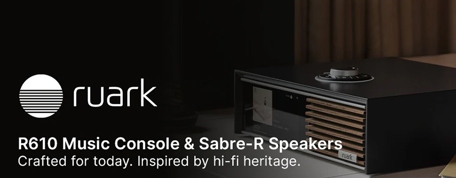 Ruark R610 Music Console displayed on a table. Text reads: "R610 Music Console & Sabre-R Speakers. Crafted for today. Inspired by hi-fi heritage." Sleek design.