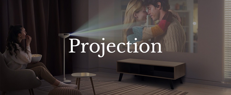 A projector emits light, casting a colourful image of a couple embracing onto a wall, creating a warm, intimate atmosphere. Large text reads "Projection."