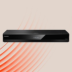 Black Blu-ray player against a beige background with red wave patterns. Sleek design, modern technology, evokes innovation and entertainment.