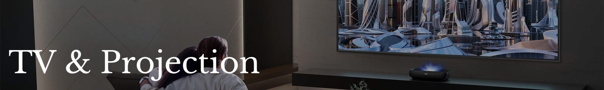 Two people sit closely on a couch watching a large TV screen displaying a futuristic cityscape. Text reads "TV & Projection." The atmosphere is cosy.