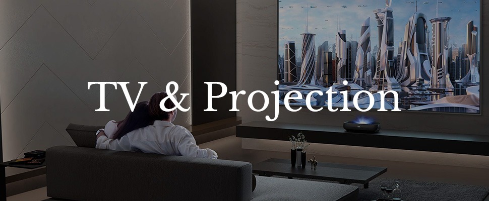 Two people sit closely on a couch watching a large TV screen displaying a futuristic cityscape. Text reads "TV & Projection." The atmosphere is cosy.