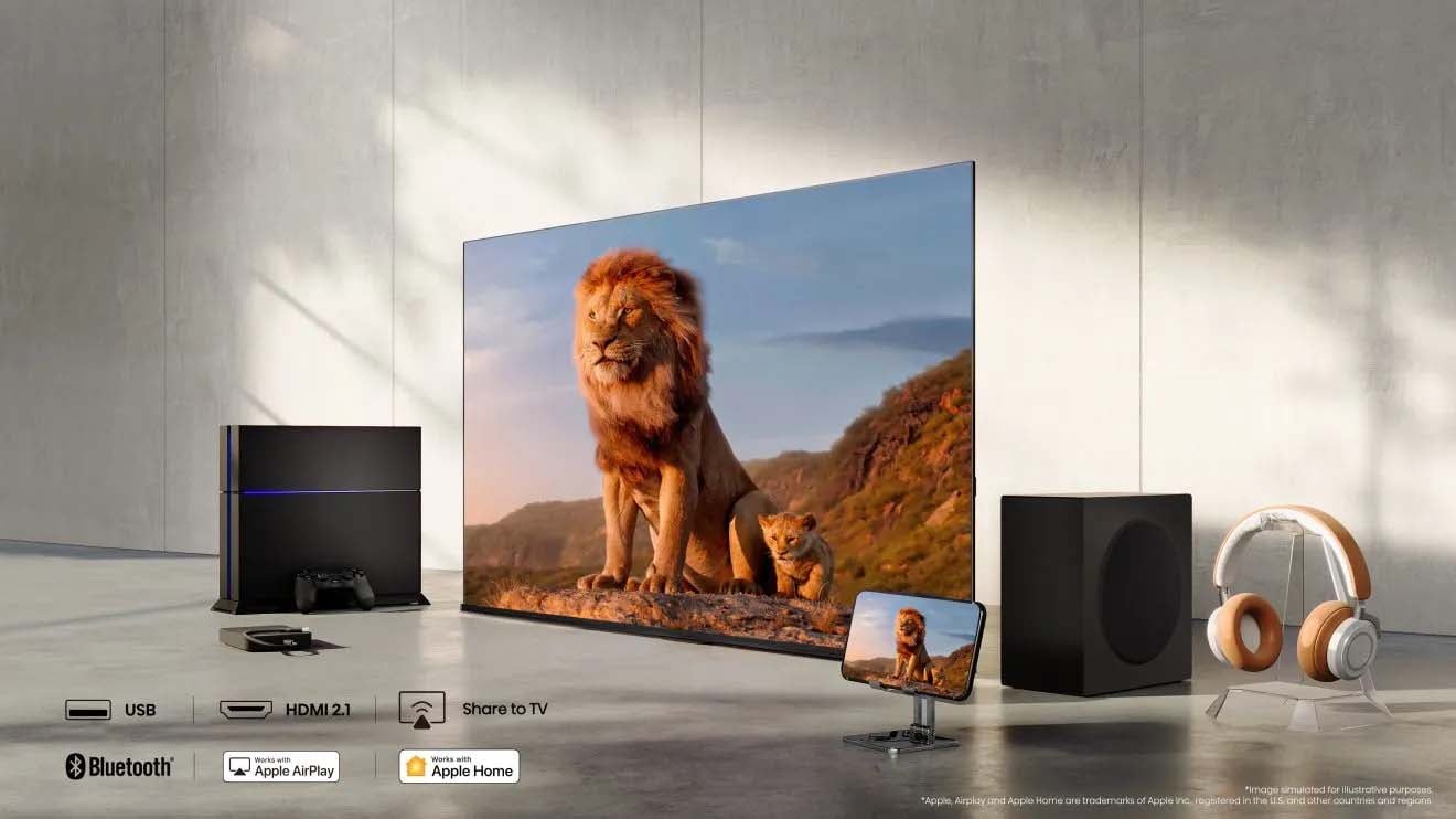 A woman stands in a living room, admiring a painting that interacts with her presence, showcasing innovative art technology.