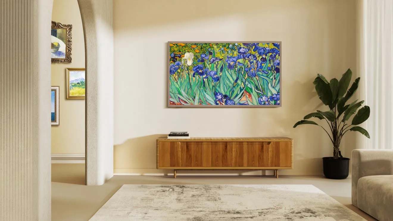 A painting of vibrant irises displayed in a cozy living room setting.