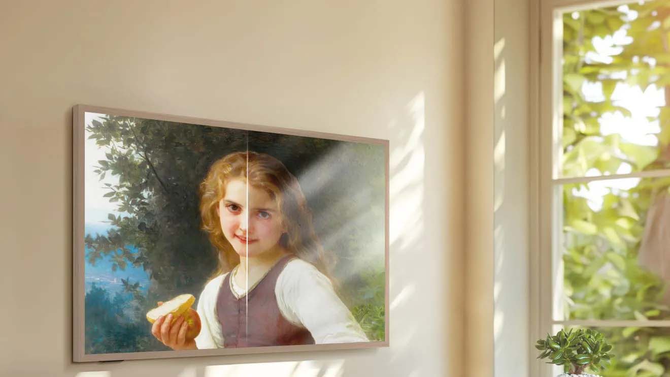 Picture of a girl holding infront of a colorful painting on the Canvas TV