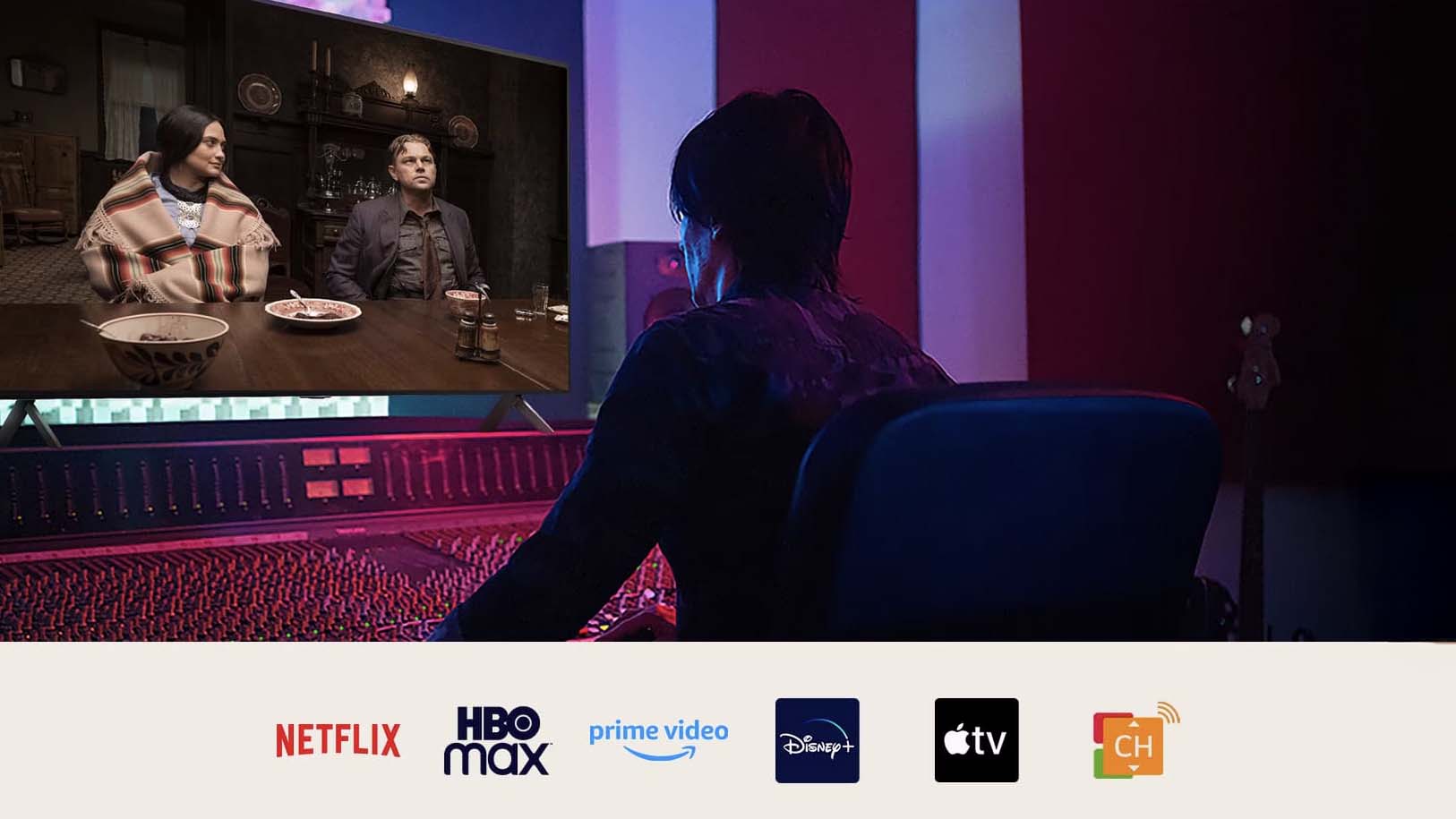 A director in front of a control panel editing the movie & Killers of the Flower Moon on an LG QNED TV. Below the image are logos for Netflix, HBOmax, Prime Video, Disney Plus, Apple TV and LG Channels. 