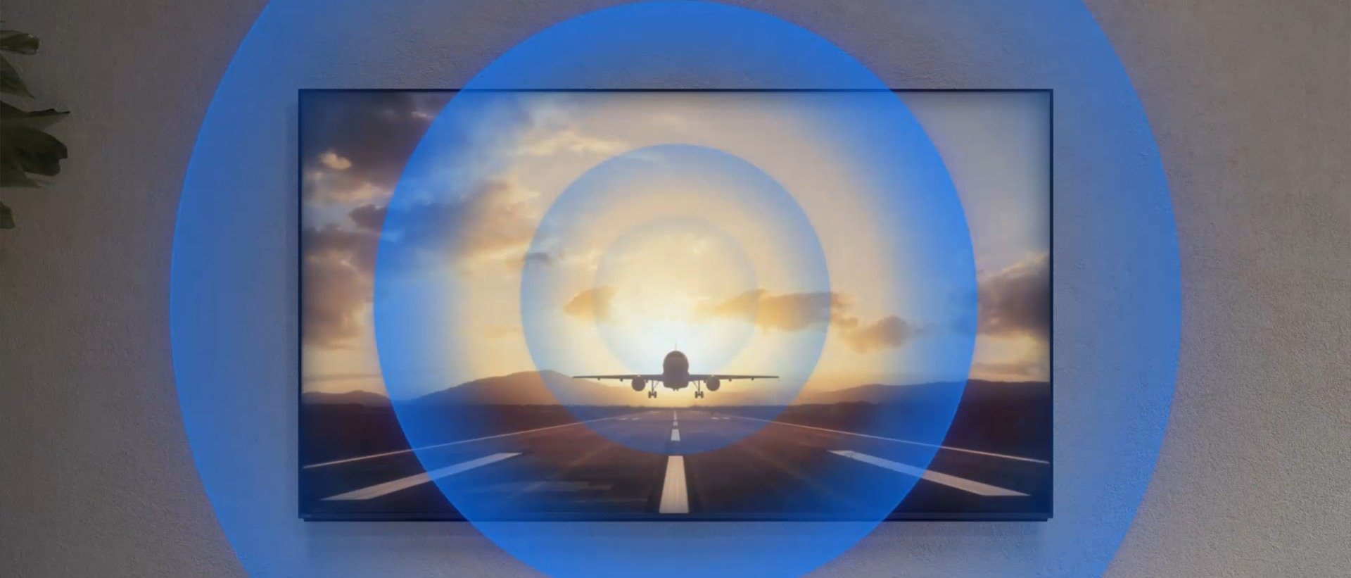 Close-up of a plane taking off, followed by a cinema scene with sound waves radiating outward, illustrating BRAVIA 9’s immersive, side-mounted speakers.