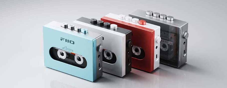 Four retro-style cassette players in blue, silver, red, and grey stand aligned. Each has visible buttons on top, evoking nostalgia and vintage vibes.