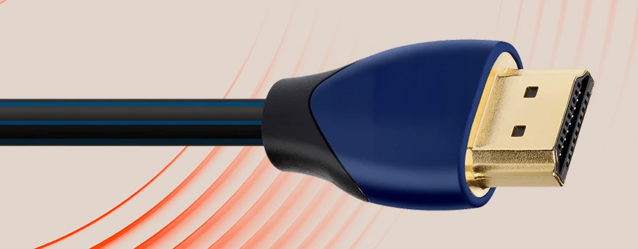 Illustration of a black HDMI cable against a beige background with orange arcs. The focus is on the connector, showcasing clean lines and curves.