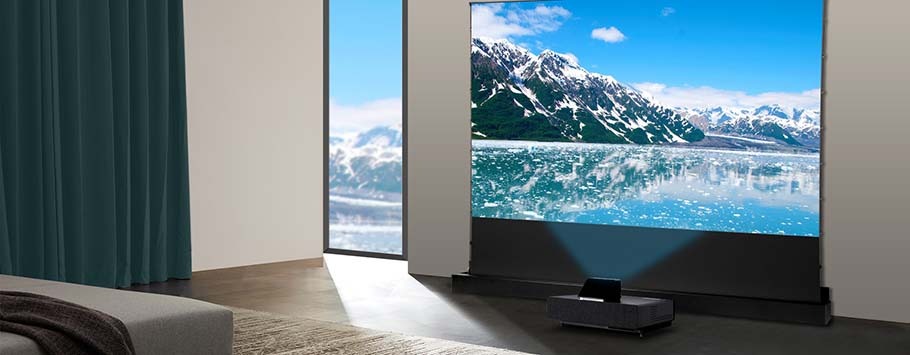 A modern living room features a large projector screen displaying a vivid mountain and lake scene. Natural light streams through a window, creating a serene atmosphere.